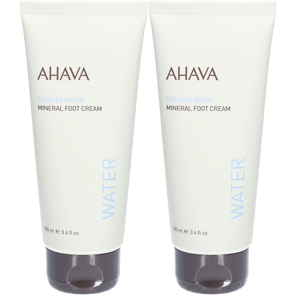 Deux tubes de crème pour les pieds AHAVA. Blancs, avec des bouchons marron. Inscription : AHAVA, Mineral Foot Cream.