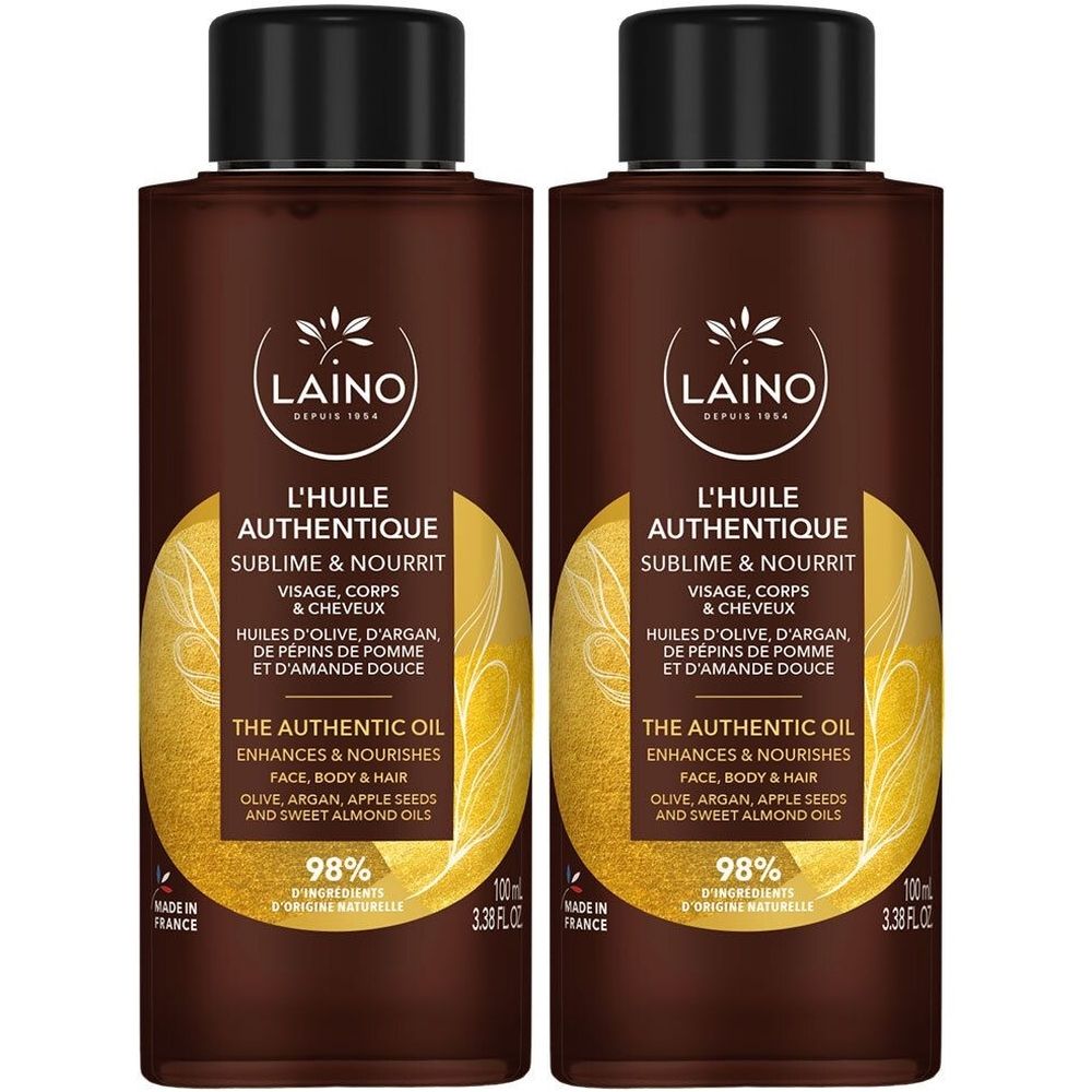 Deux flacons bruns avec bouchons noirs. Inscription : L'Huile Authentique, Sublime & Nourrit. Contient huiles d'olive, d'argan, de pépins de pomme et d'amande douce. 98% ingrédients naturels.