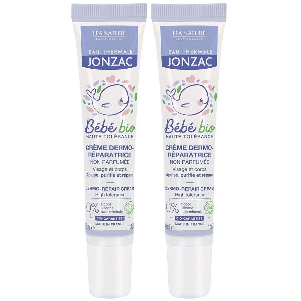 Deux tubes de crème Jonzac Bébé bio. Inscription: Crème Dermo-Réparatrice. Certification Bio-Garantie. Tubes blancs, bouchons bleus.