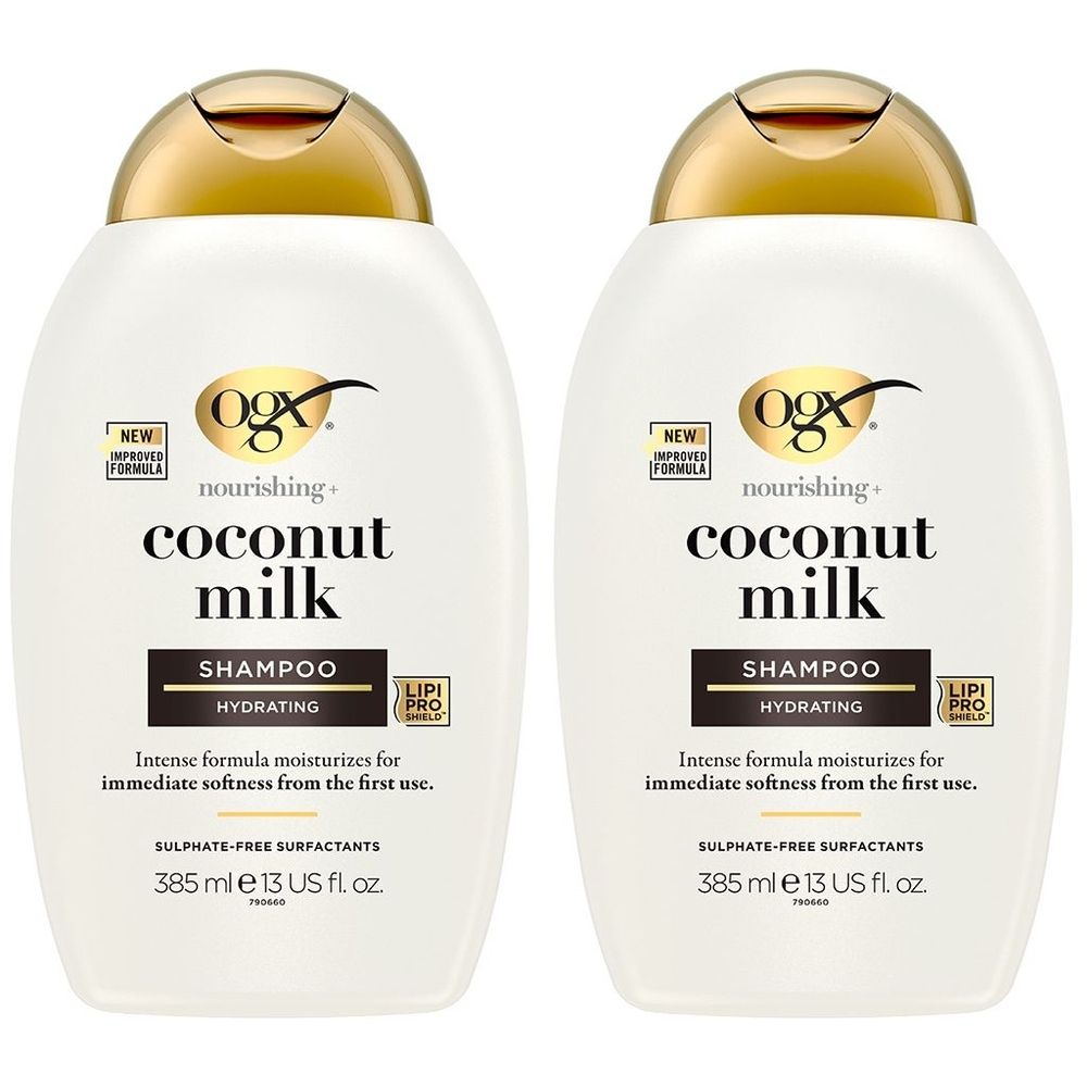 Deux flacons de shampooing blancs avec bouchons dorés. Inscription : OGX, Coconut Milk, Shampooing. Contient des informations sur l'hydratation.