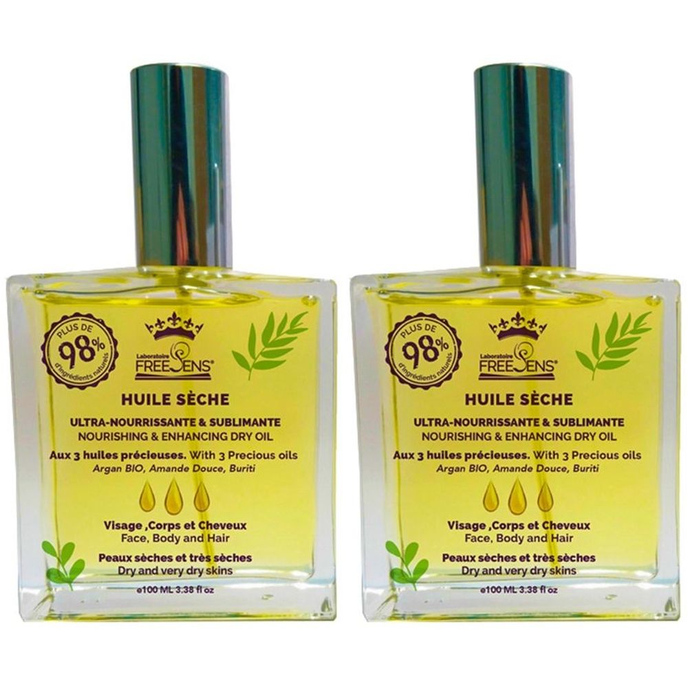 Deux flacons carrés en verre contenant de l'huile jaune. Inscription : Huile Sèche, Ultra-Nourrissante & Sublimante. Avec 3 huiles. Pour peaux sèches.