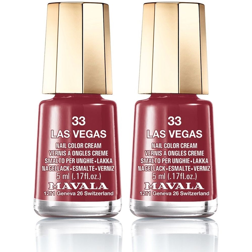 Deux flacons de vernis à ongles rouge-brun. Inscription : 33 Las Vegas, Nail Color Cream, 5 ml. Marque : Mavala. Bouchon doré.