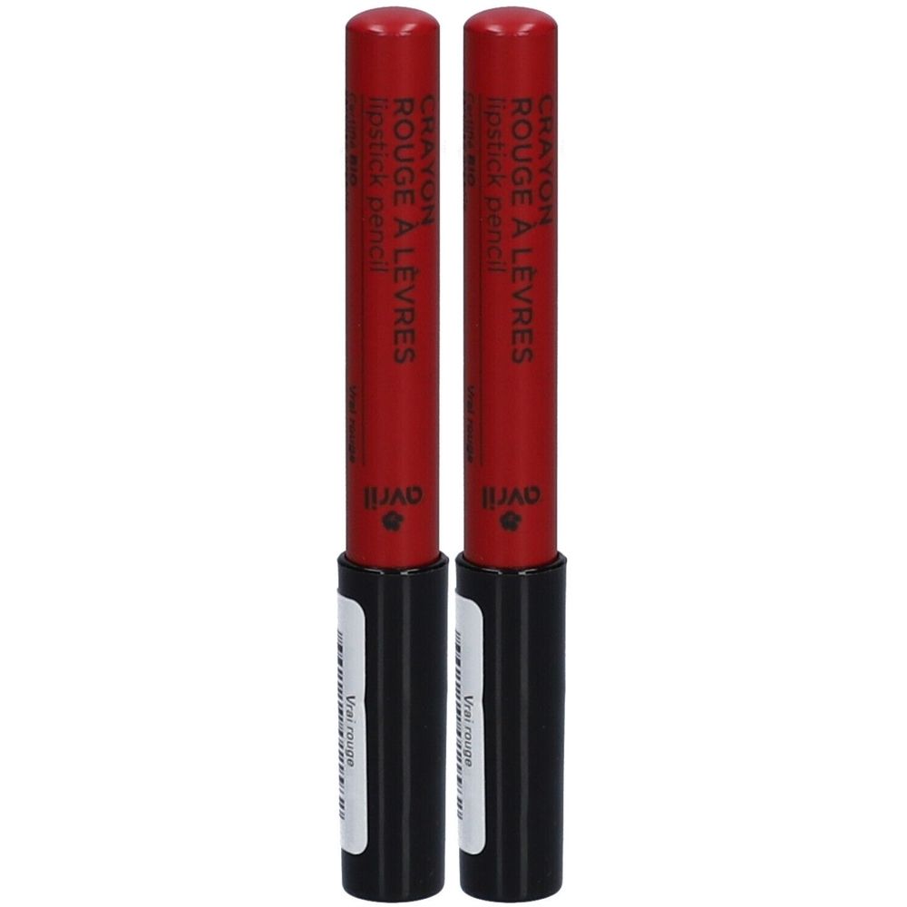 Deux crayons à lèvres rouges. Inscription : Crayon Rouge à Lèvres, Avril. Étui noir avec étiquette blanche. Capuchon rouge.