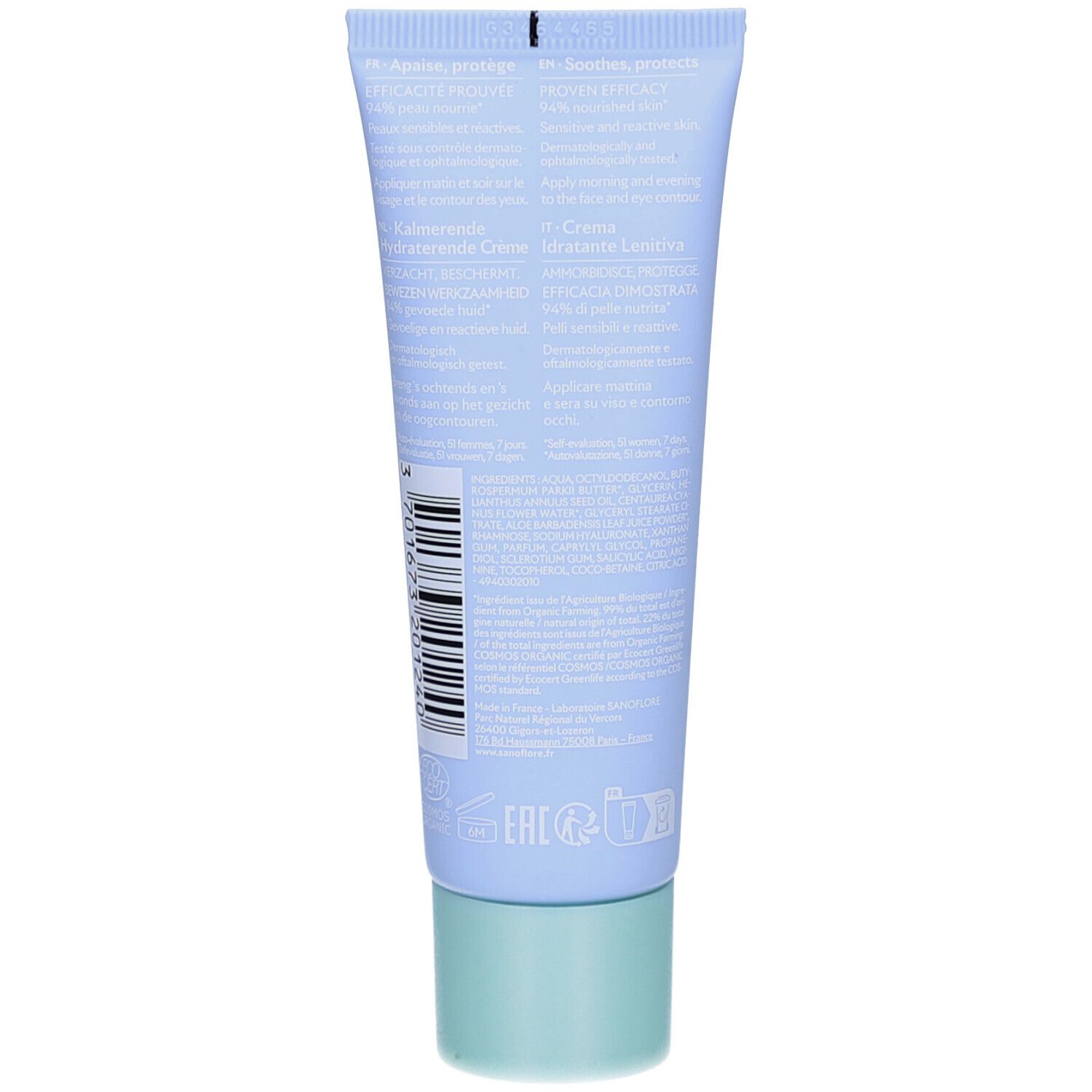 Dos du tube bleu clair. Texte multilingue. Code-barres et informations. Bouchon vert.