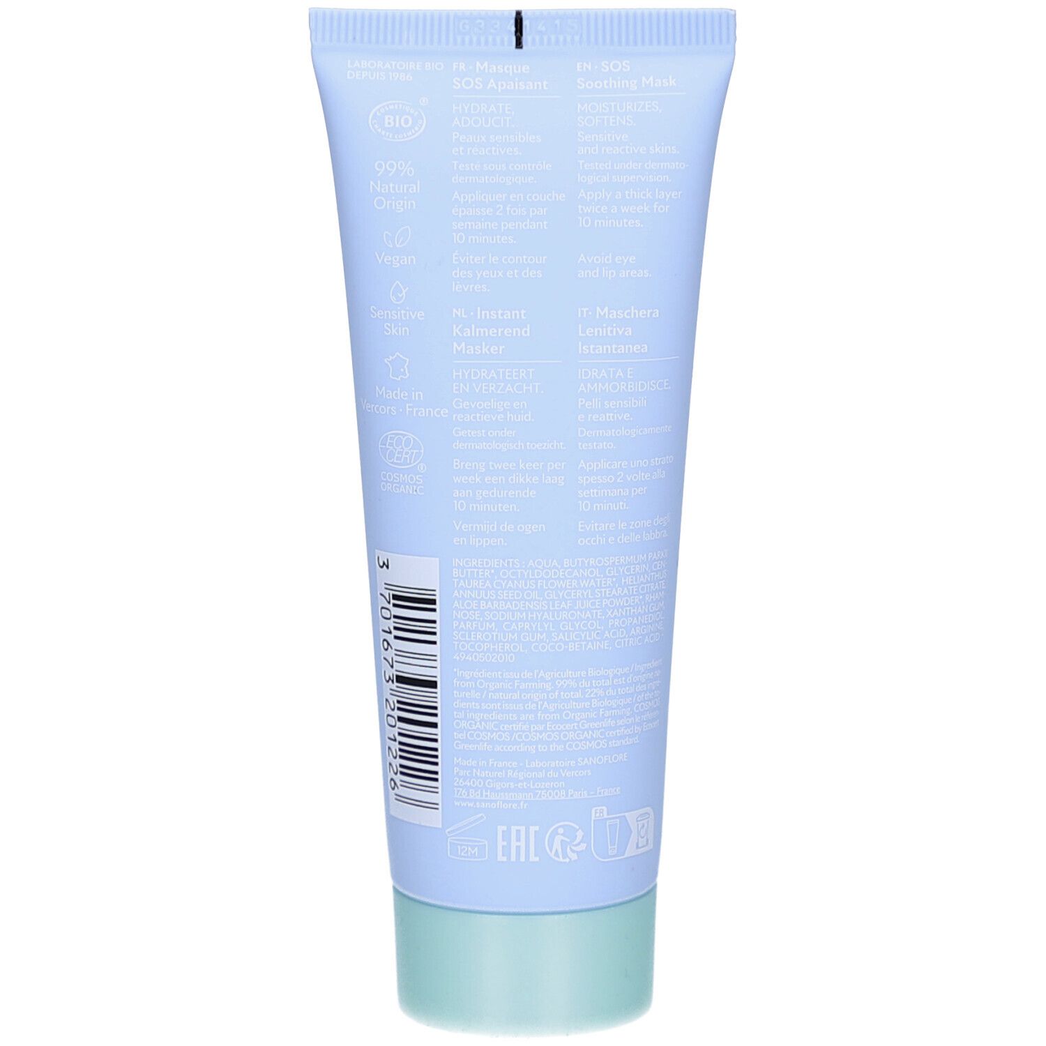 Dos du tube bleu clair. Texte multilingue. Bouchon vert. Code-barres et certification bio.