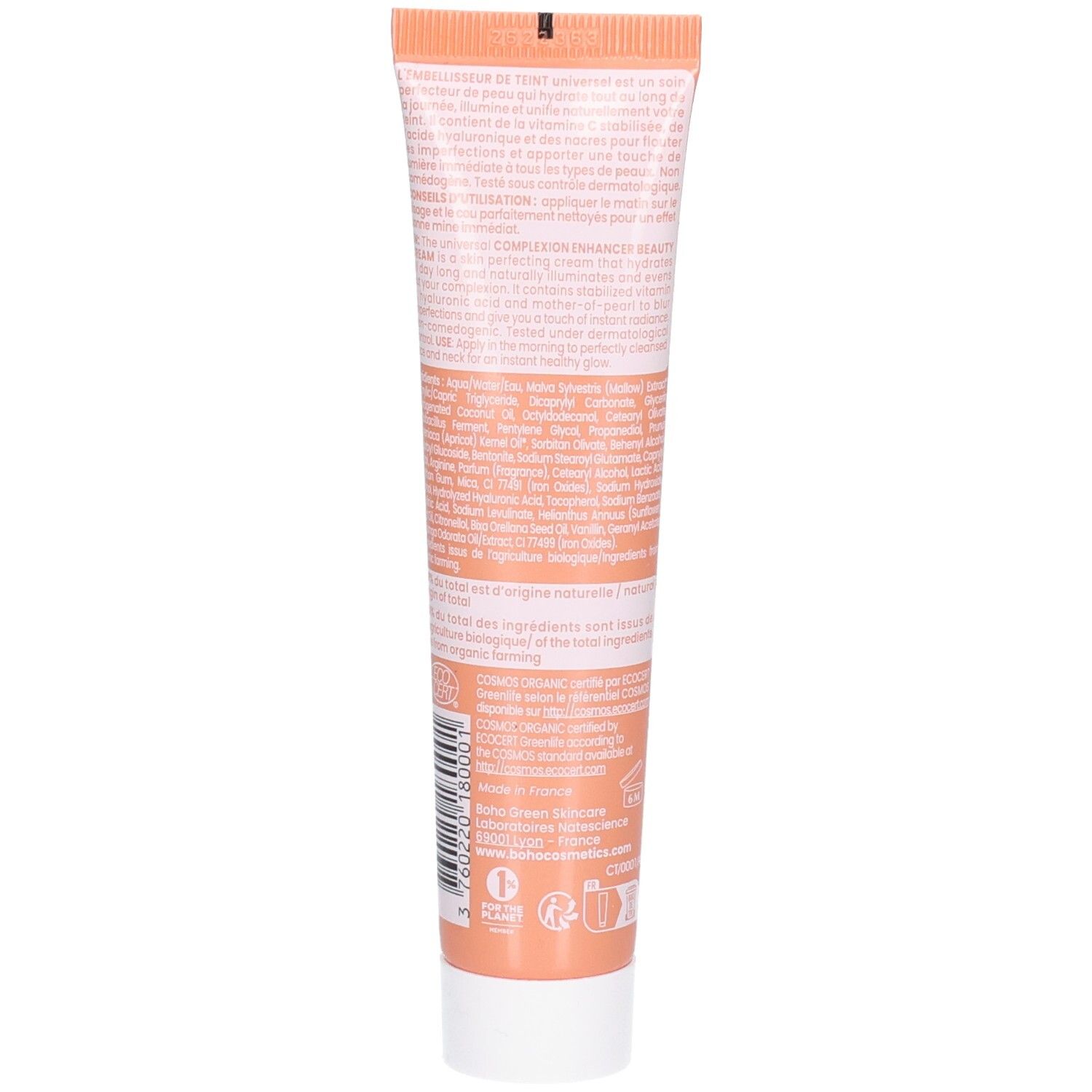 Arrière d'un tube orange avec informations détaillées sur le produit et ingrédients en écriture blanche.