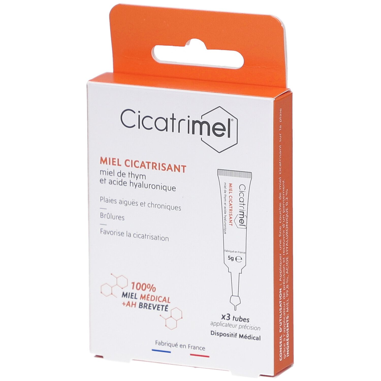 Boîte de CICATRIMEL MIEL CICATRISANT. Contient 3 tubes. Inscription: MIEL CICATRISANT, 100% MIEL MEDICAL + AH BREVETE. Boîte orange et blanche.