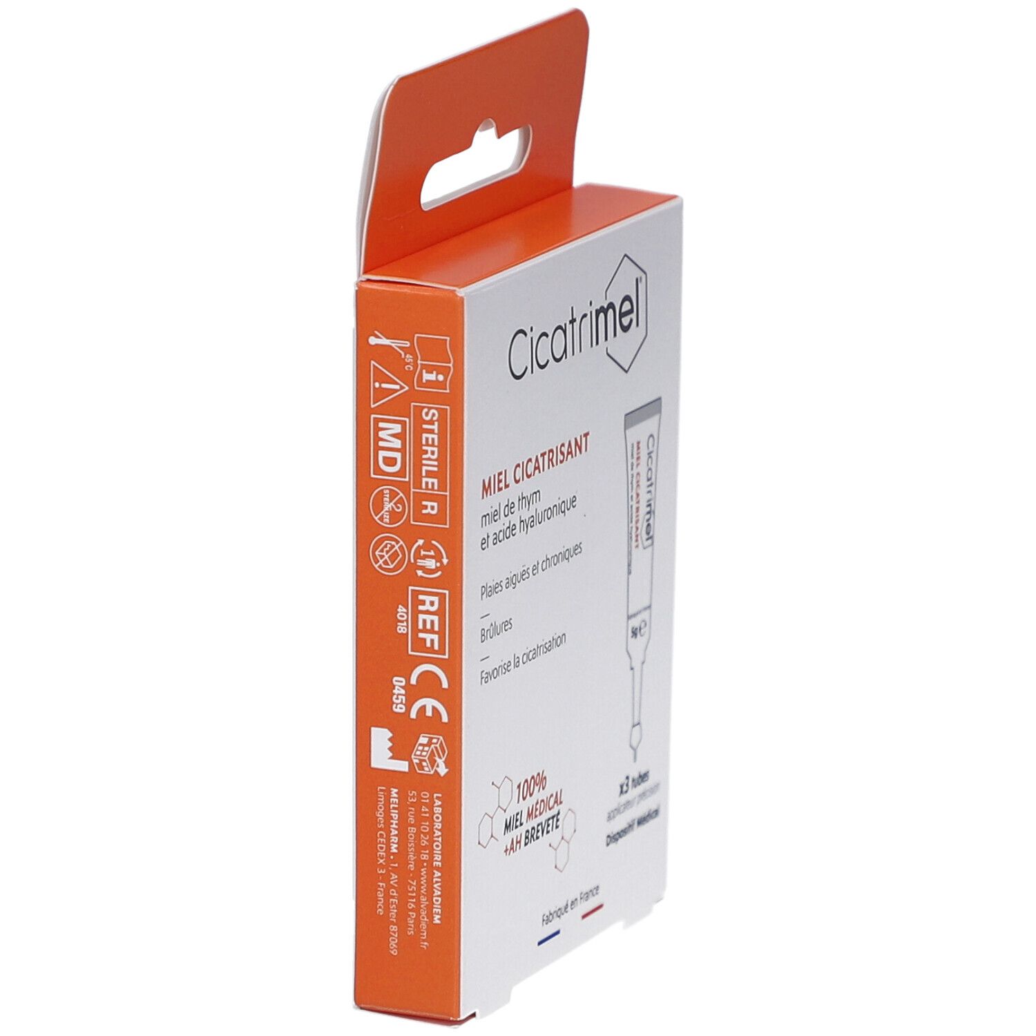 Vue latérale de l'emballage de CICATRIMEL MIEL CICATRISANT. Boîte orange et blanche avec informations et logo. Marquage Stérile et CE.