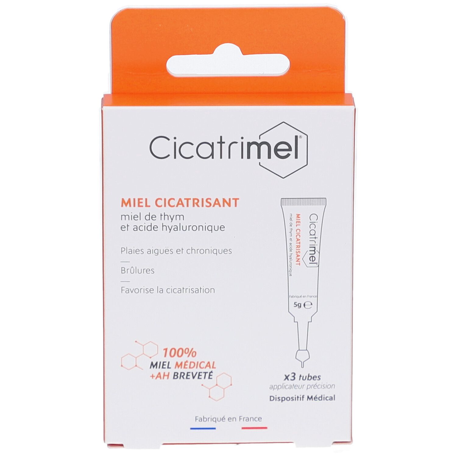 Boîte de CICATRIMEL MIEL CICATRISANT. Contient 3 tubes. Inscription: MIEL CICATRISANT, 100% MIEL MEDICAL + AH BREVETE. Boîte orange et blanche.