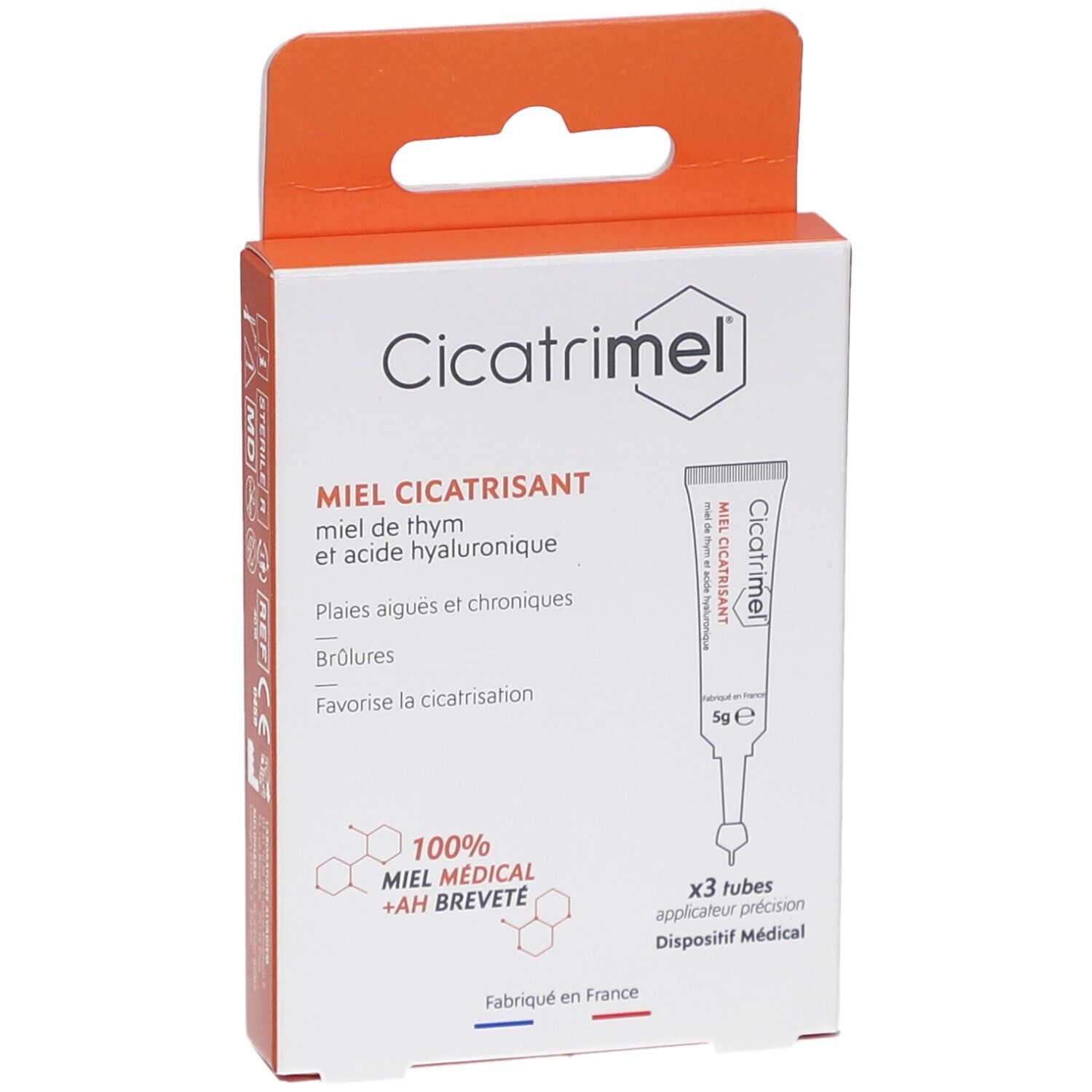 Boîte de CICATRIMEL MIEL CICATRISANT. Contient 3 tubes. Inscription: MIEL CICATRISANT, 100% MIEL MEDICAL + AH BREVETE. Boîte orange et blanche.
