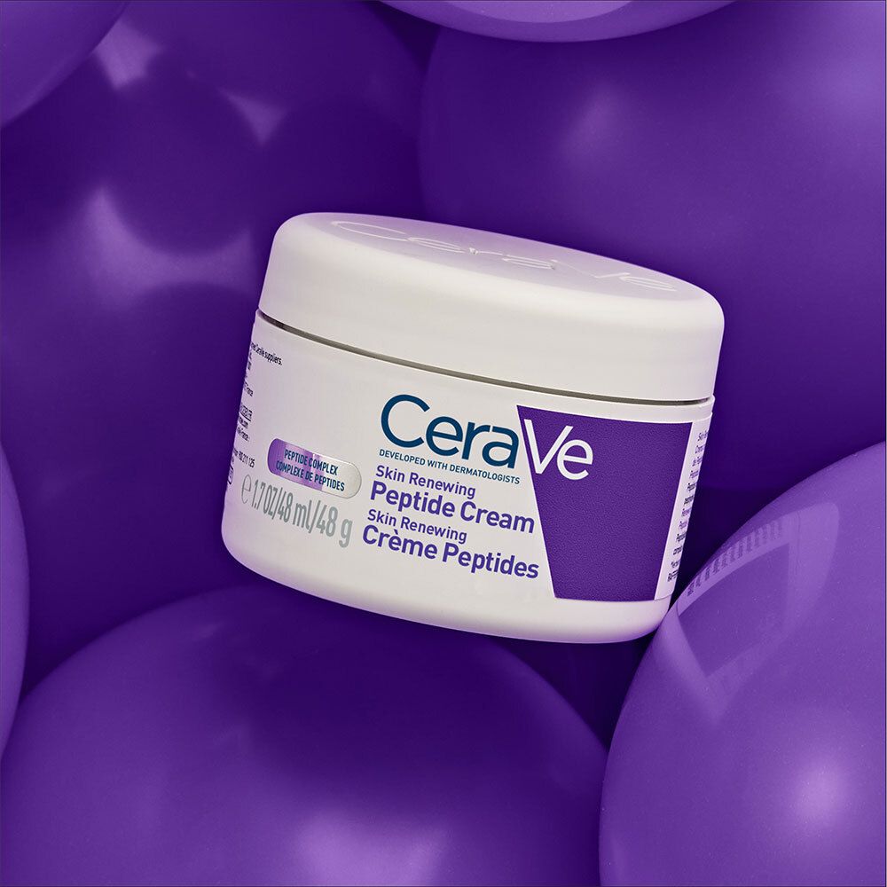Pot sur ballons violets. Inscription: CeraVe, Skin Renewing Peptide Cream.