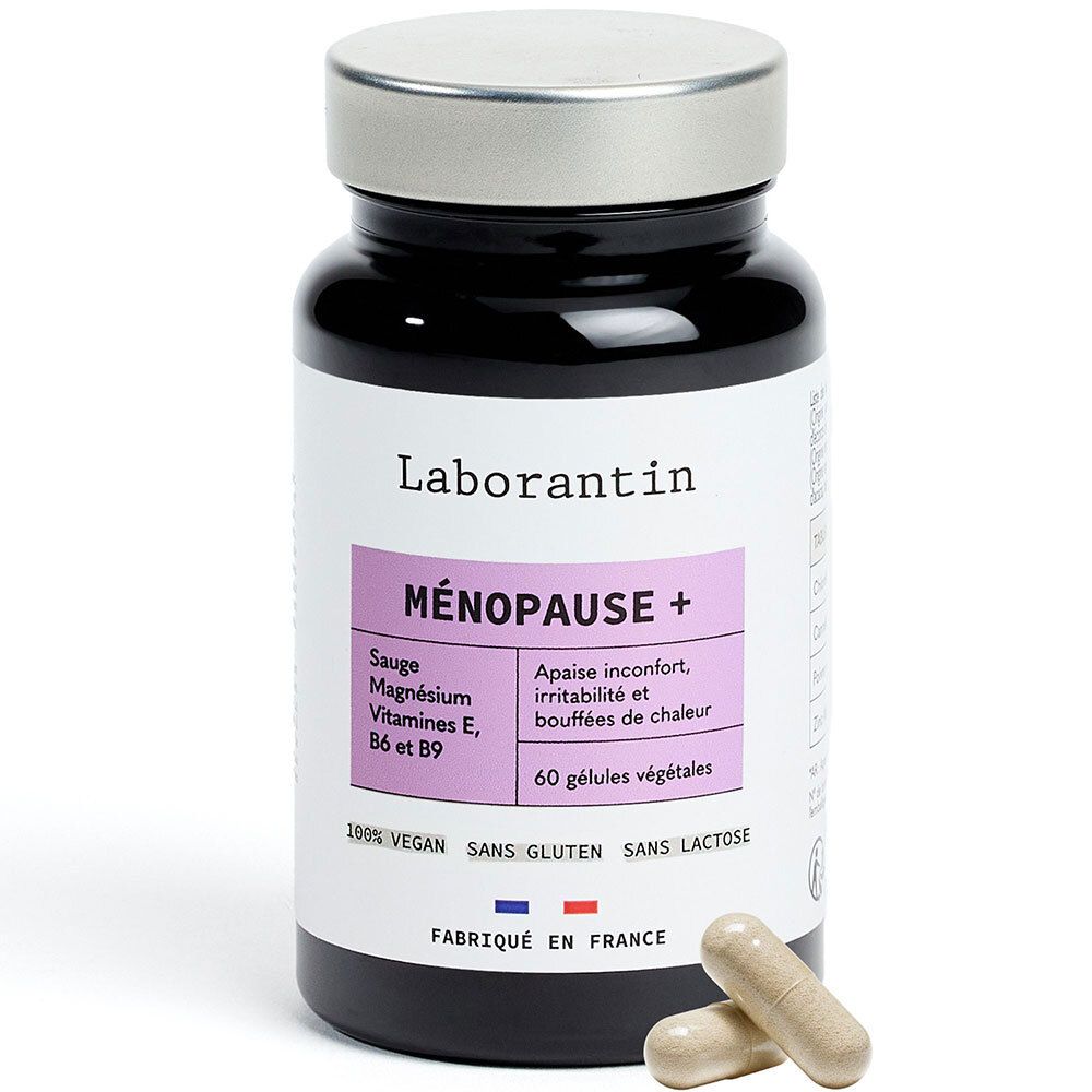 Flacon noir, bouchon argenté. Étiquette avec nom et ingrédients. Deux gélules à côté.