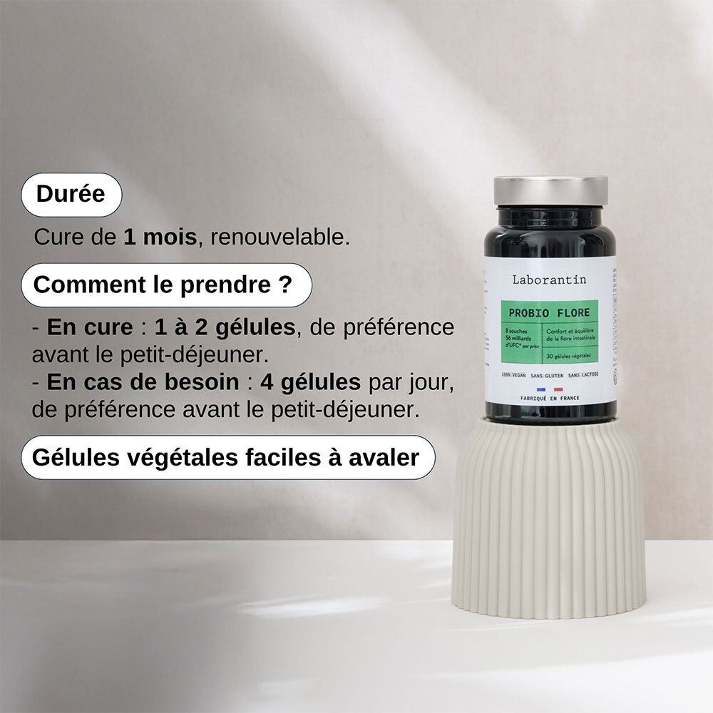 Flacon PROBIO FLORE sur socle. Texte: Cure de 1 mois, 1-2 gélules avant le petit-déjeuner, 4 gélules si besoin.