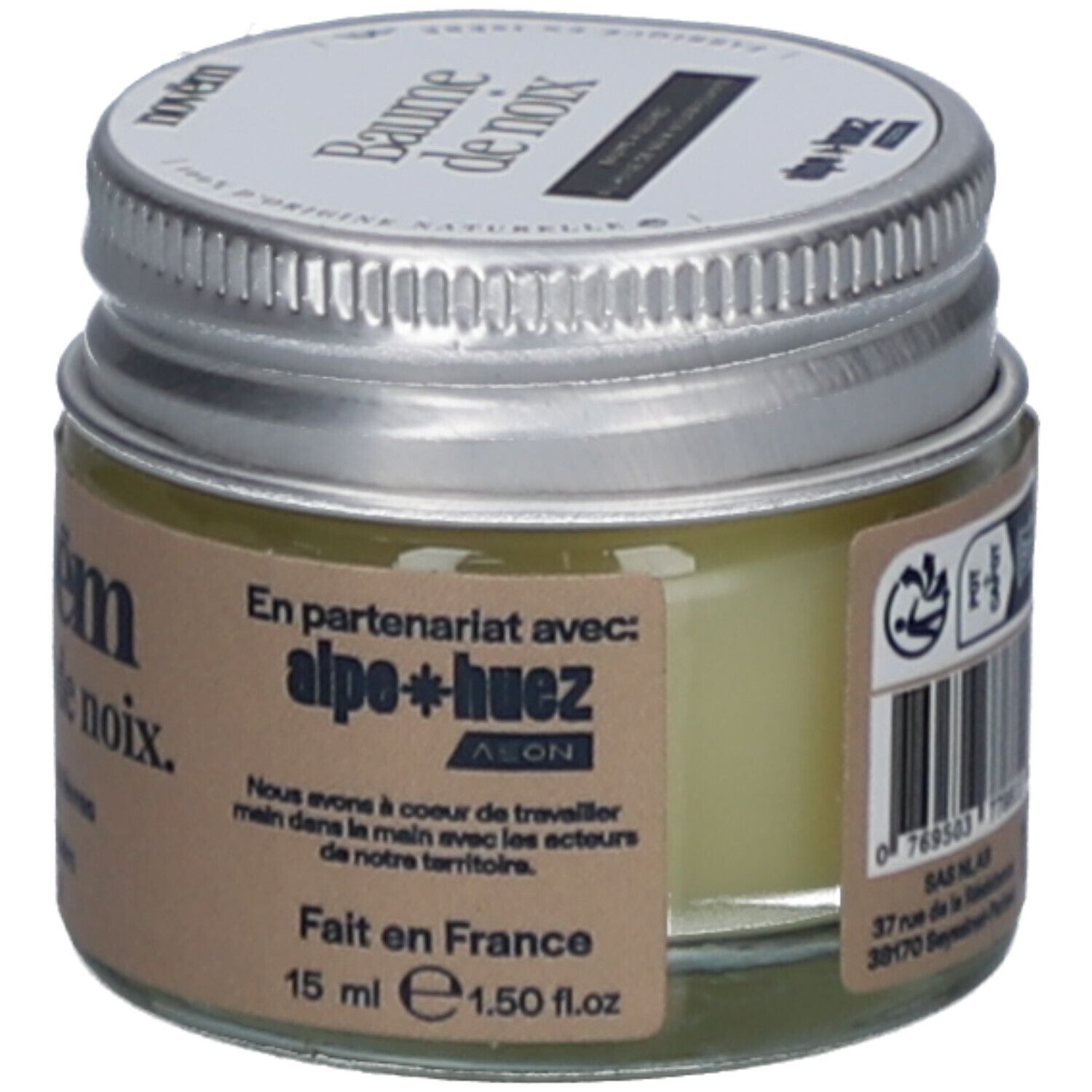 Pot en verre avec couvercle argenté. Étiquette avec nom du produit: novëm Baume de noix. 15 ml. Fabriqué en France. En partenariat avec alpe+huez.