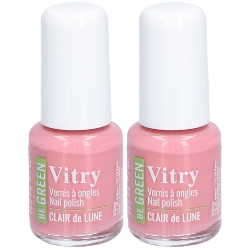 Deux flacons de vernis à ongles. Liquide rose dans des flacons en verre avec des bouchons blancs. Inscription : Vitry, Clair de Lune.