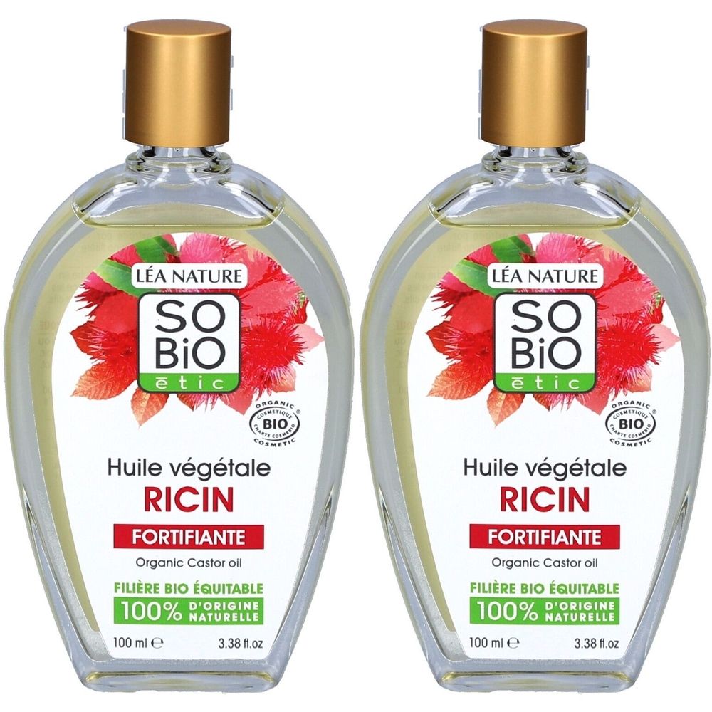 Deux flacons d'huile de ricin SO BIO ETIC. Flacons ovales transparents avec bouchons dorés. Étiquettes avec motifs floraux et texte.