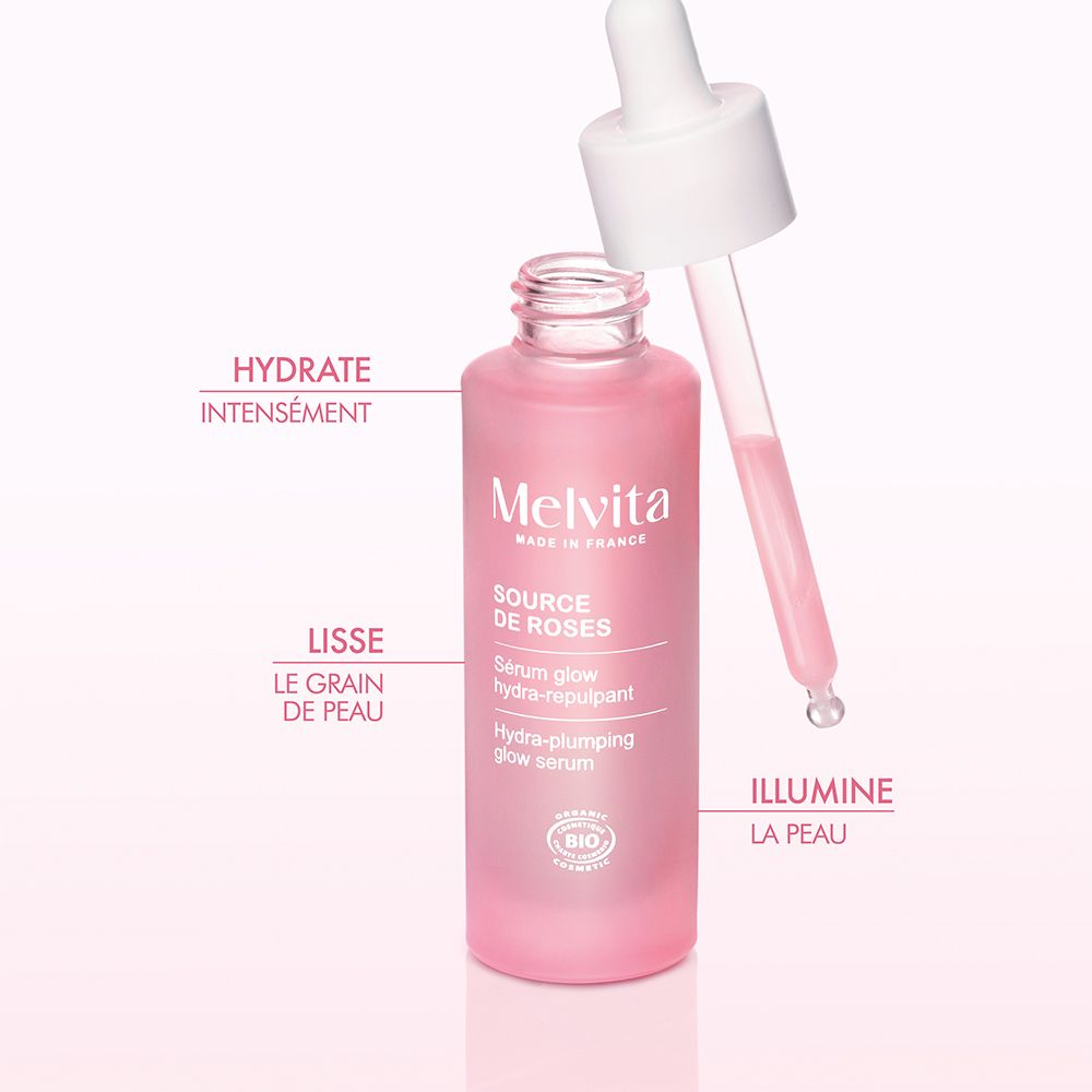 Flacon rose avec pipette. Sérum Melvita Source de Roses. Texte et logo BIO.