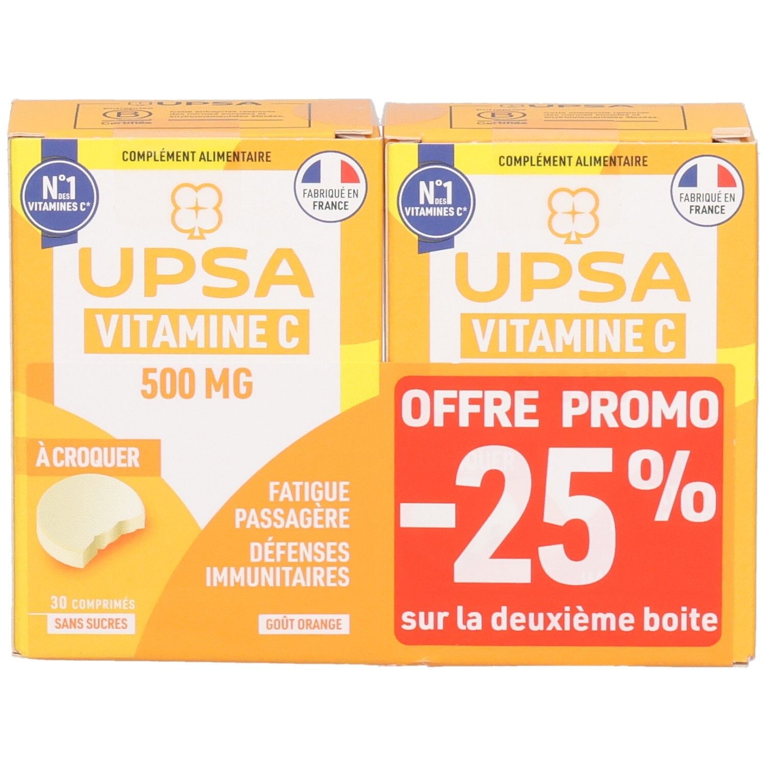 Deux boîtes UPSA Vitamine C 500mg. Emballage jaune avec texte blanc et logo. Une affiche "-25% de réduction".