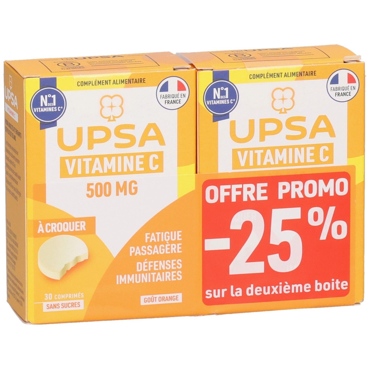 Deux boîtes UPSA Vitamine C 500mg. Emballage jaune avec texte blanc et logo. Une affiche "-25% de réduction".