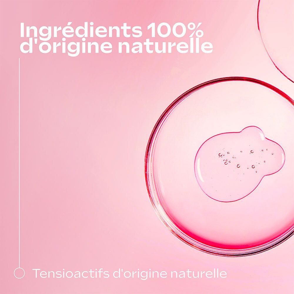 Liquide transparent dans des récipients ronds. Texte: 100% d'origine naturelle. Tensioactifs d'origine naturelle.