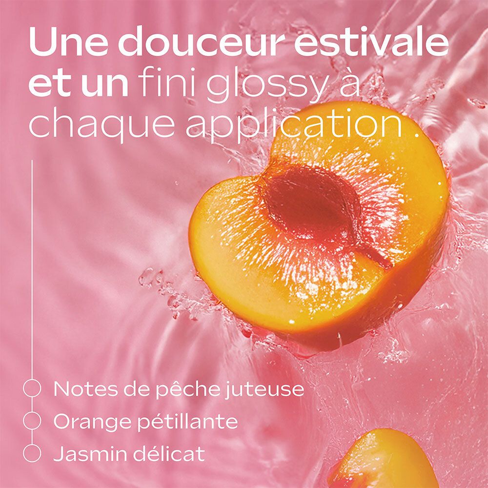 Moitié de pêche dans un liquide rose. Texte: Notes de pêche juteuse, orange pétillante, jasmin délicat.