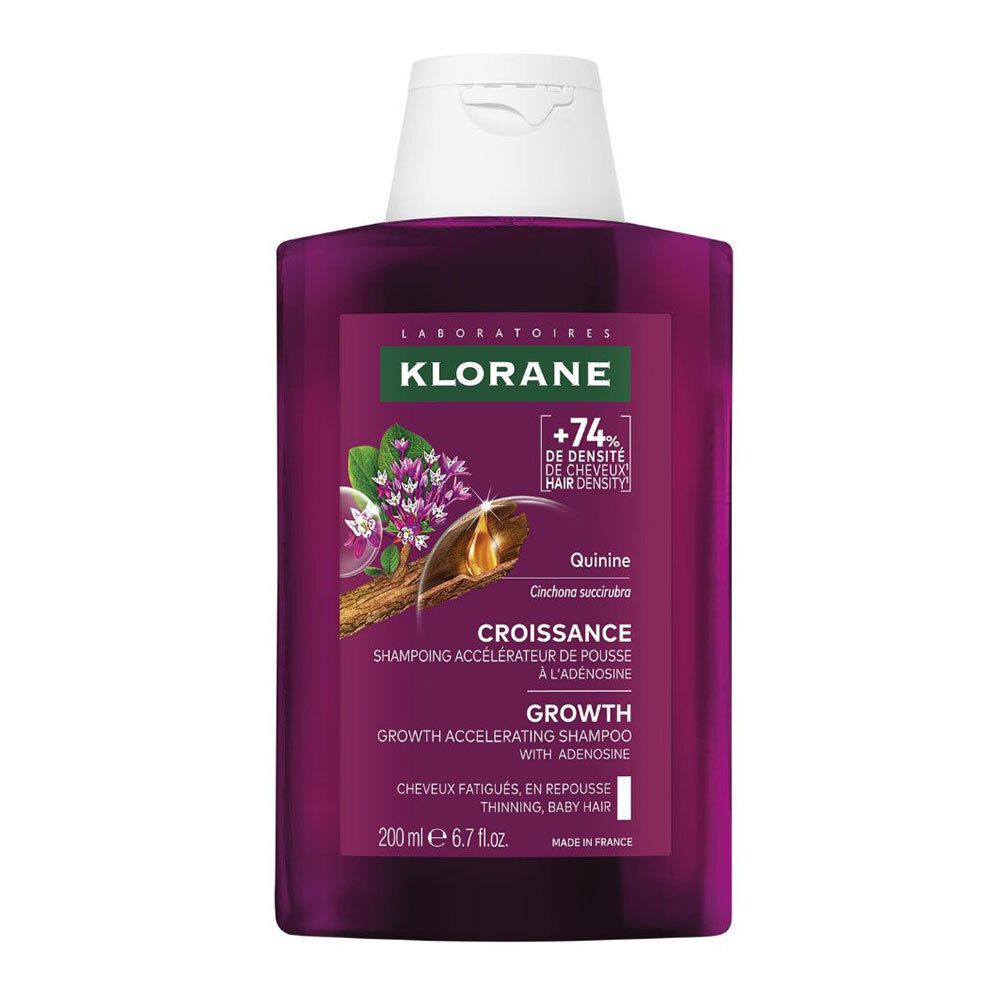 Flacon de shampooing Klorane Croissance. Flacon violet avec bouchon blanc. Étiquette avec nom et logo. Texte : +74% densité cheveux.