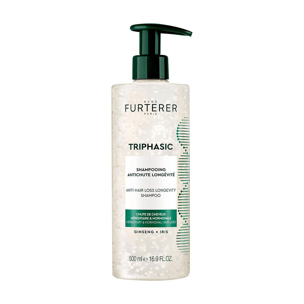 Flacon transparent de shampooing Furterer Triphasic avec pompe verte. Inscriptions du produit et ingrédients visibles.