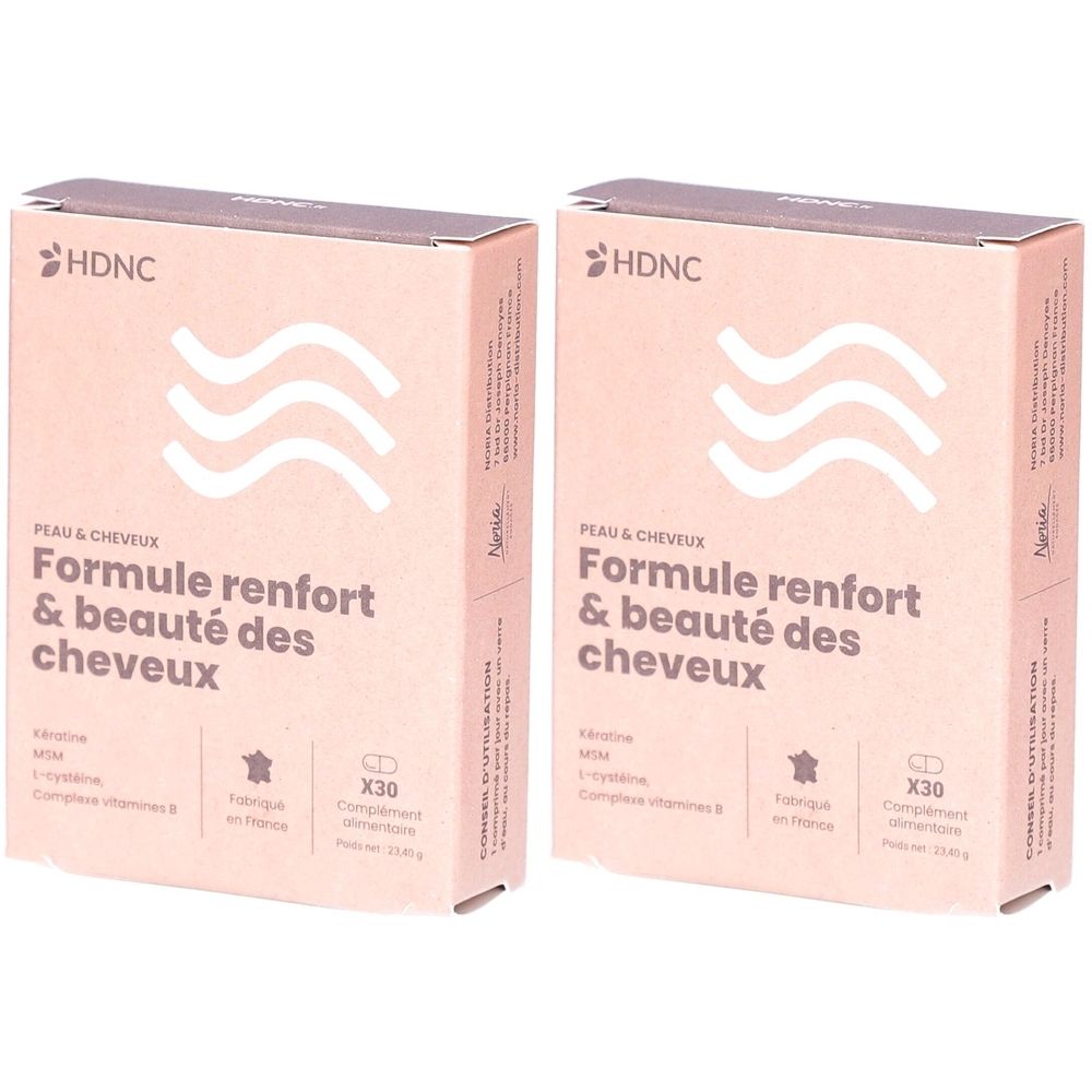 Deux boîtes HDNC, Formule renfort & beauté des cheveux. Emballage rose avec motif de vagues et texte.
