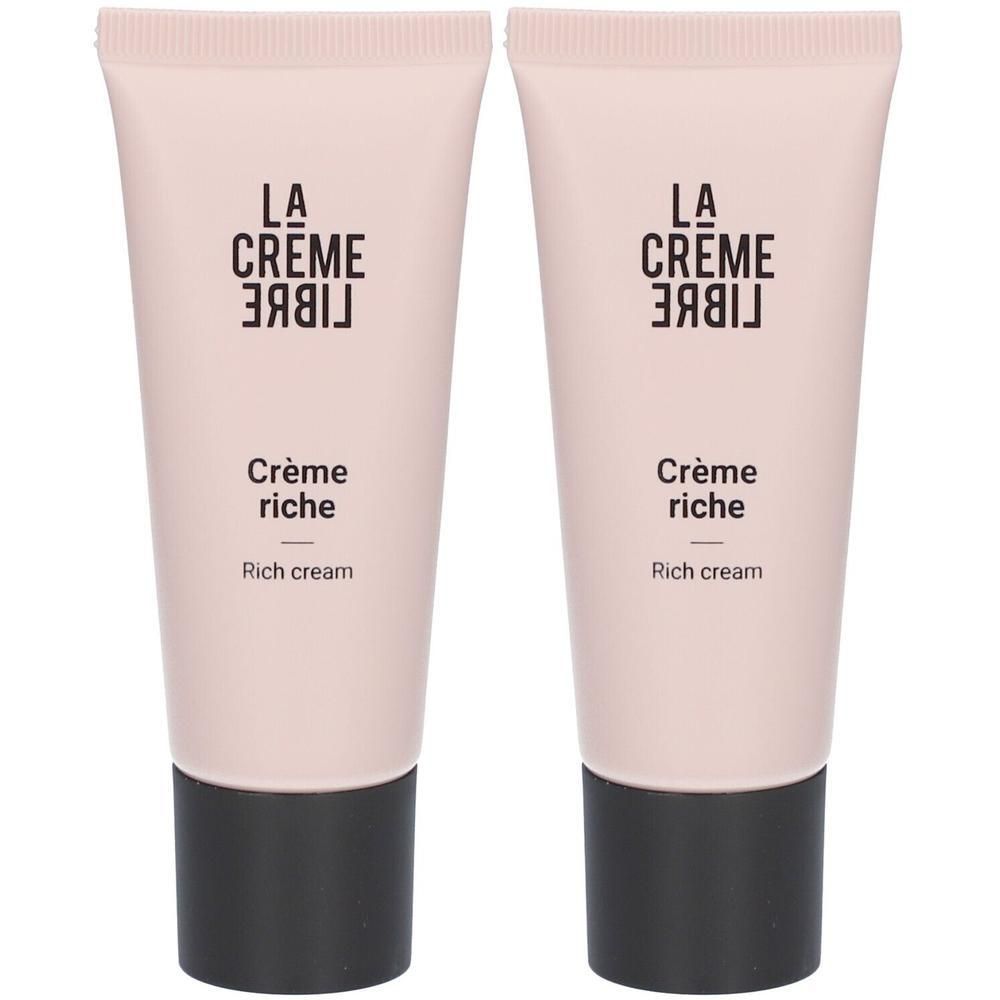 Deux tubes de crème. Tubes rose clair avec bouchon noir. Inscription : La Crème Libre, Crème riche, Rich cream.