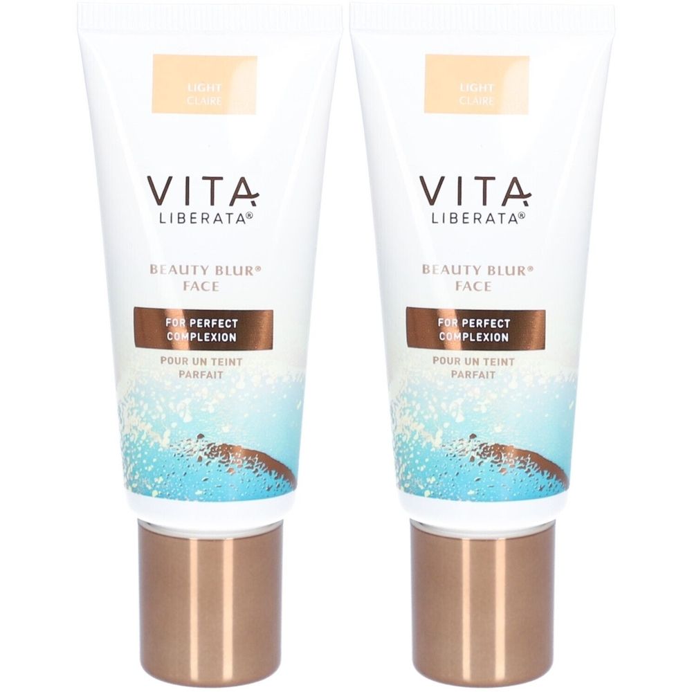 Deux tubes de VITA LIBERATA Beauty Blur Clair. Tubes blancs avec bouchons marron. Texte: Beauty Blur Face, Pour un teint parfait.
