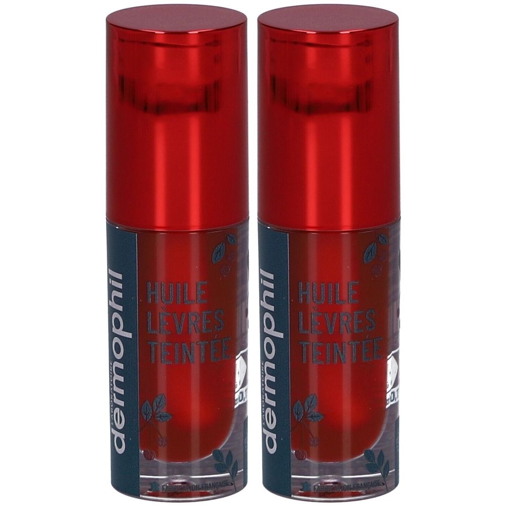 Deux huiles à lèvres avec bouchon rouge. Inscription: dermophil, Huile Lèvres Teintée. Flacons transparents avec liquide rouge.