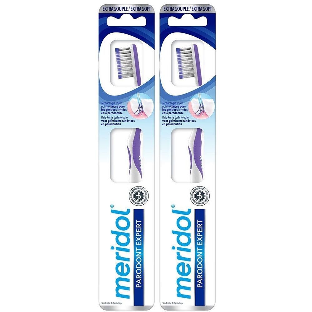 Deux paquets de brosses à dents. Inscription : meridol PARODONT EXPERT. Extra Souple/Extra Soft. Têtes de brosse à dents violettes et blanches.