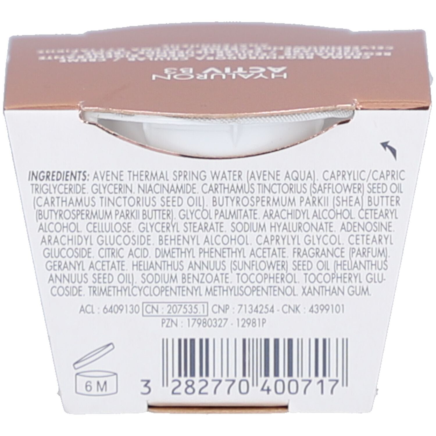 Boîte avec ingrédients et code-barres. Texte avec ingrédients et numéros de lot. Code-barres en bas.