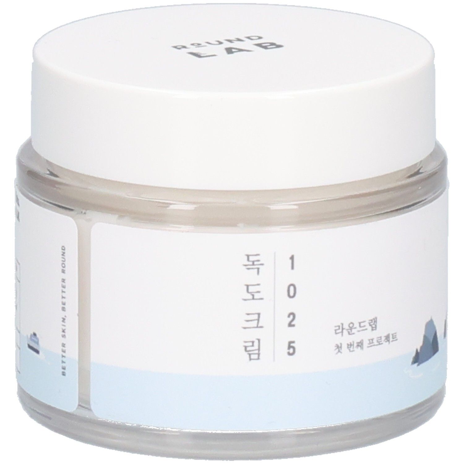 Pot rond transparent avec couvercle blanc. Étiquette avec texte coréen et logo. "ROUND LAB" en haut.