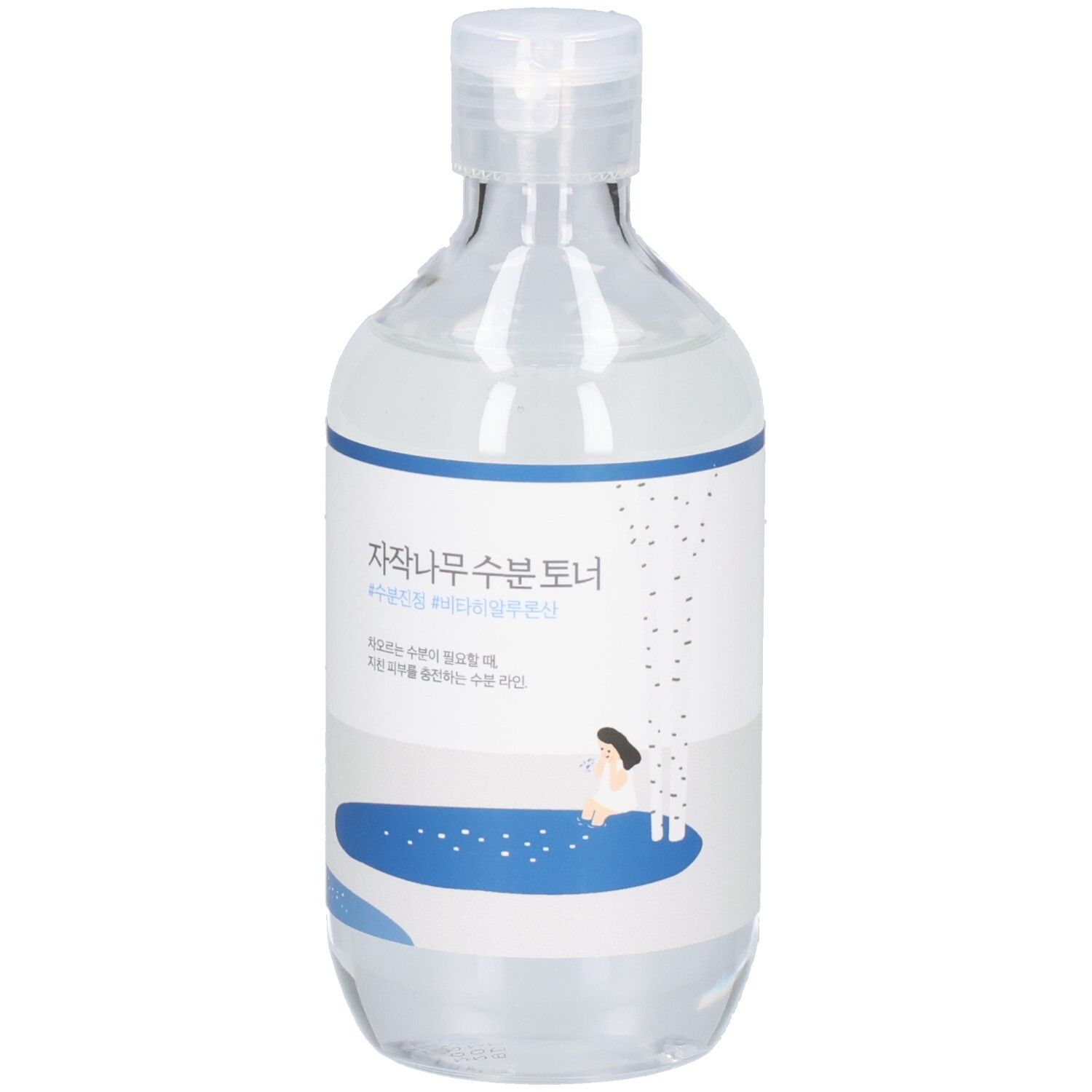 Flacon transparent avec étiquette bleue et blanche. Inscriptions coréennes. Bouchon en haut.