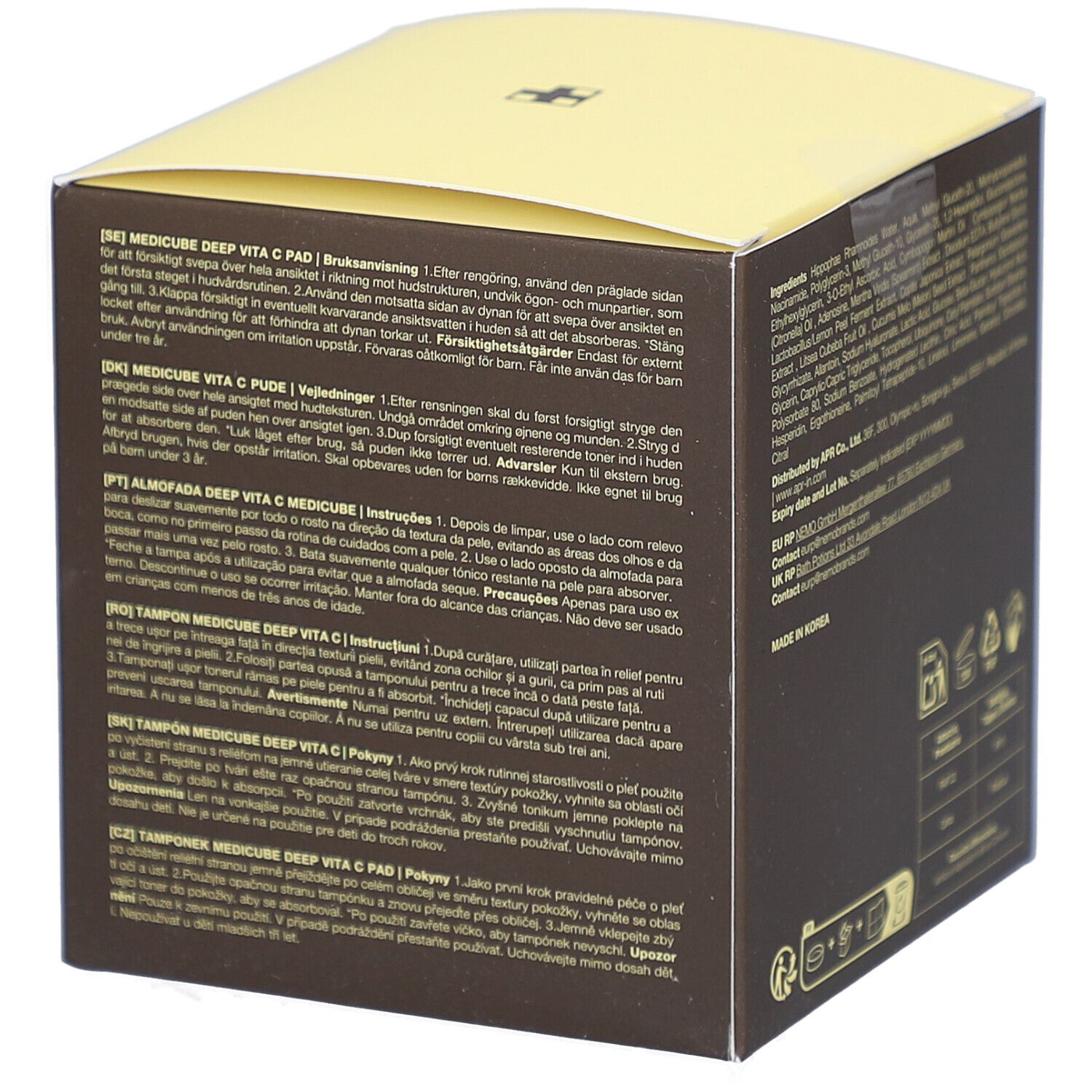 Boîte marron et couvercle jaune. Inscriptions: medicube, DEEP VITA C PAD, Vitamin Water, Vitamin C Derivative, Niacinamide 2%. Mode d'emploi.