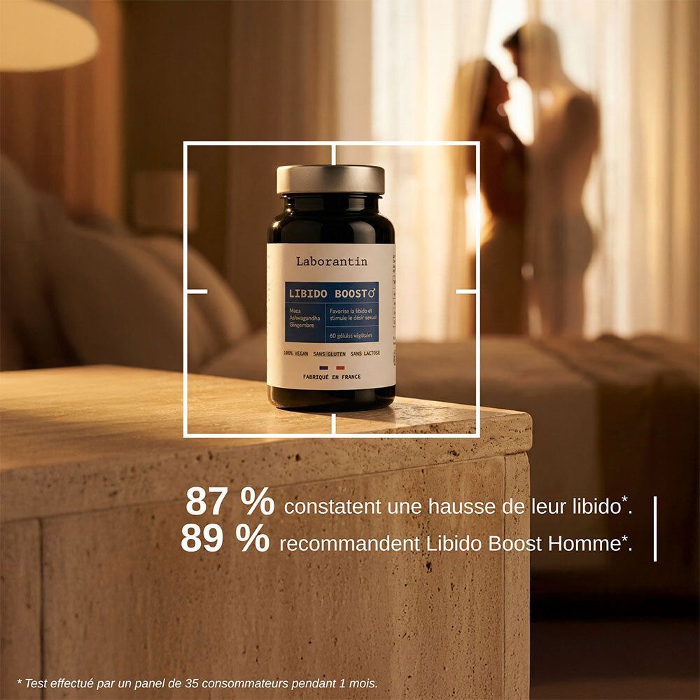Flacon de produit sur table de chevet. Texte: LABORANTIN, LIBIDO BOOST. Fond: couple dans chambre.