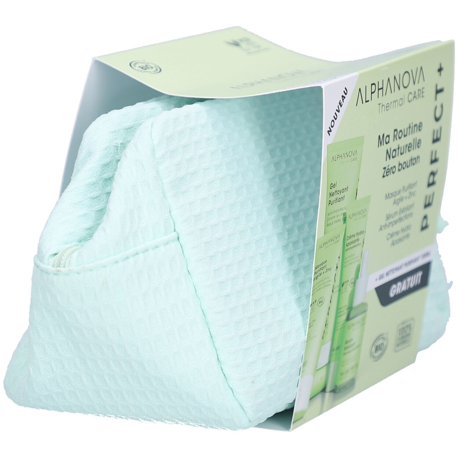 Trousse de toilette dans son emballage. Trousse verte avec fermeture éclair. Emballage avec logo et nom du produit.