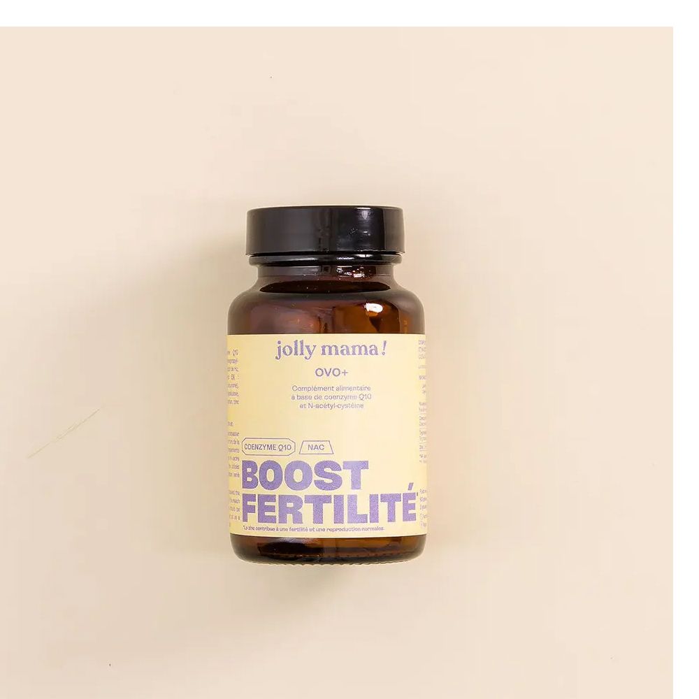 Flacon en verre brun avec bouchon noir. L'étiquette indique "jolly mama! OVO+" et "BOOST FERTILITÉ".
