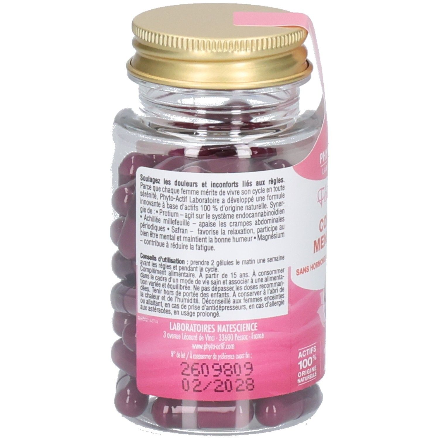 Vue arrière du flacon avec texte. Étiquette rose avec informations sur le produit. Bouchon doré.