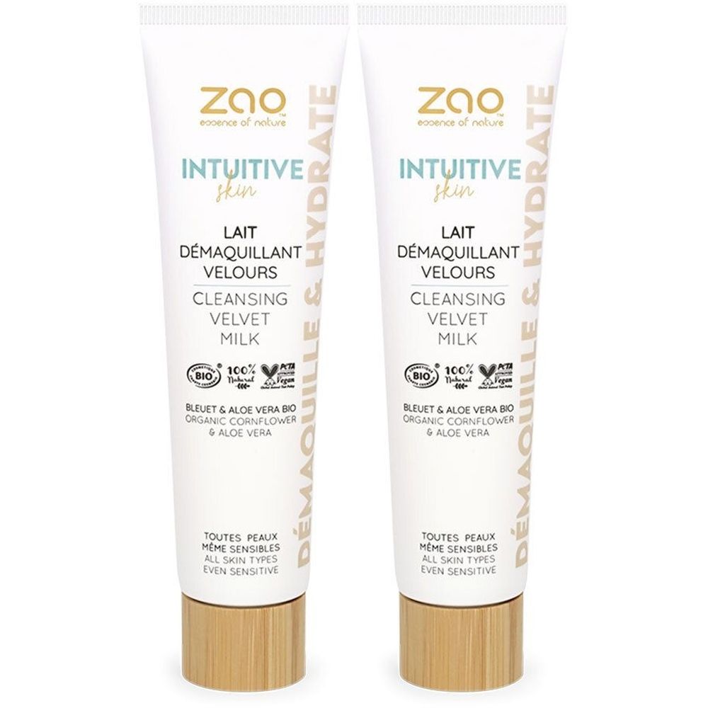 Deux tubes de ZAO MAKE UP Lait Démaquillant Velours. Tubes blancs avec bouchons marron. Texte : Intuitive Skin, Cleansing Velvet Milk.