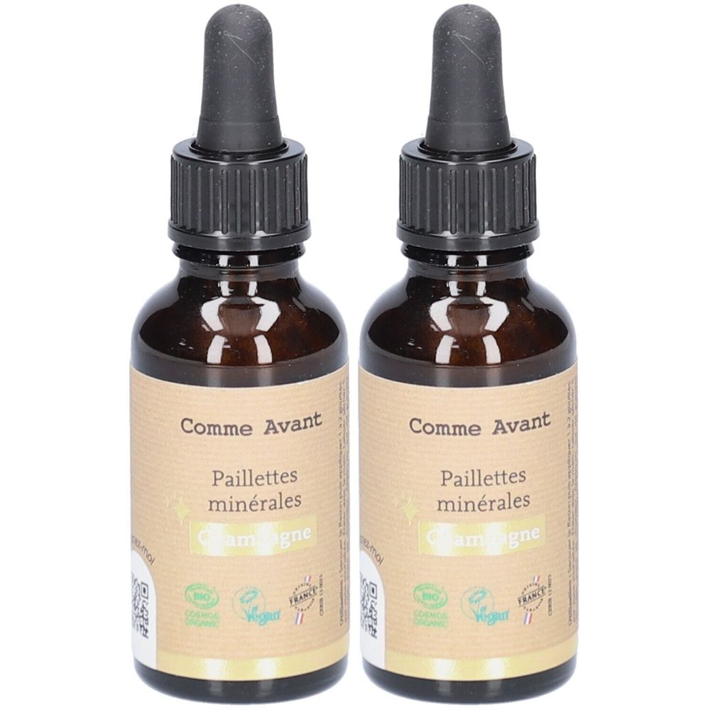 Deux flacons en verre brun avec pipettes noires. Étiquettes avec "Comme Avant", "Paillettes minérales" et "Champagne". Certifications.