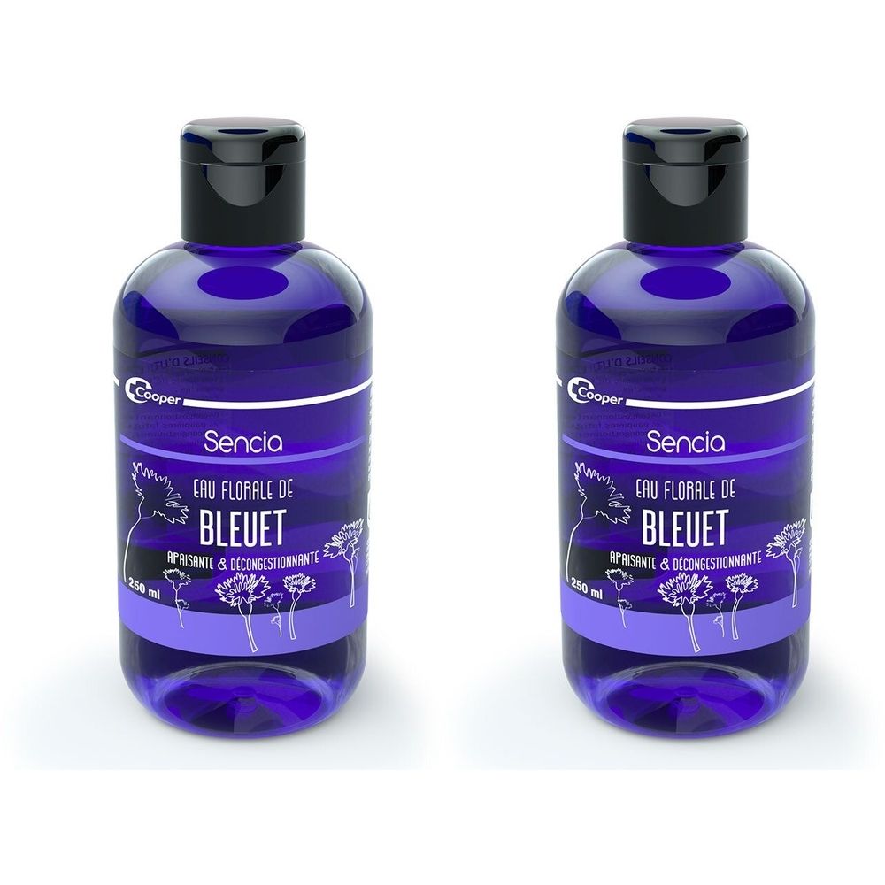 Deux flacons bleus avec bouchon noir. Inscription: Sencia Eau Florale de Bleuet. Marque: Cooper. 250 ml.