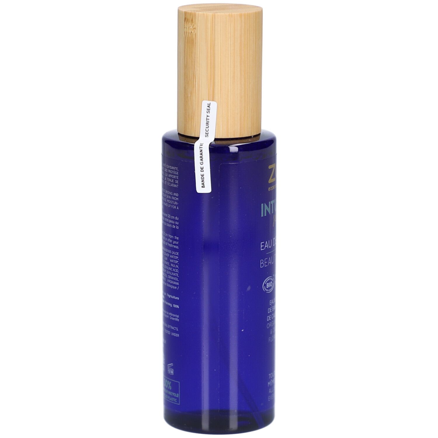 Flacon bleu avec bouchon en bois. Fermeture de sécurité. Inscription : ZAO, Intuitive Skin, Eau de Beauté, Beauty Water.