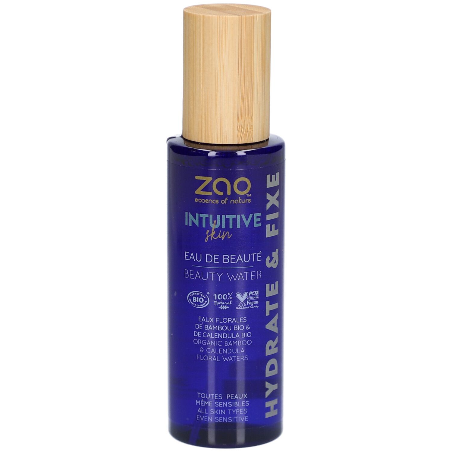 Flacon bleu avec bouchon en bois. Inscription : ZAO, Intuitive Skin, Eau de Beauté, Beauty Water. Hydrate & Fixe.