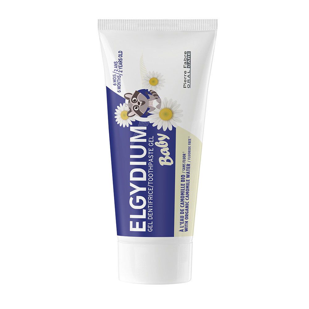 Gel dentifrice ELGYDIUM Baby. Tube blanche, texte bleu, illustration de fleurs de camomille. Pour 6 mois à 2 ans.