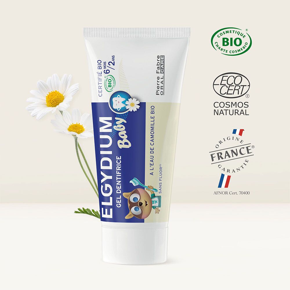 Gel dentifrice ELGYDIUM Baby. Certifications : Bio, EcoCert, Origine France Garantie. Fleurs de camomille. Logo Pierre Fabre.