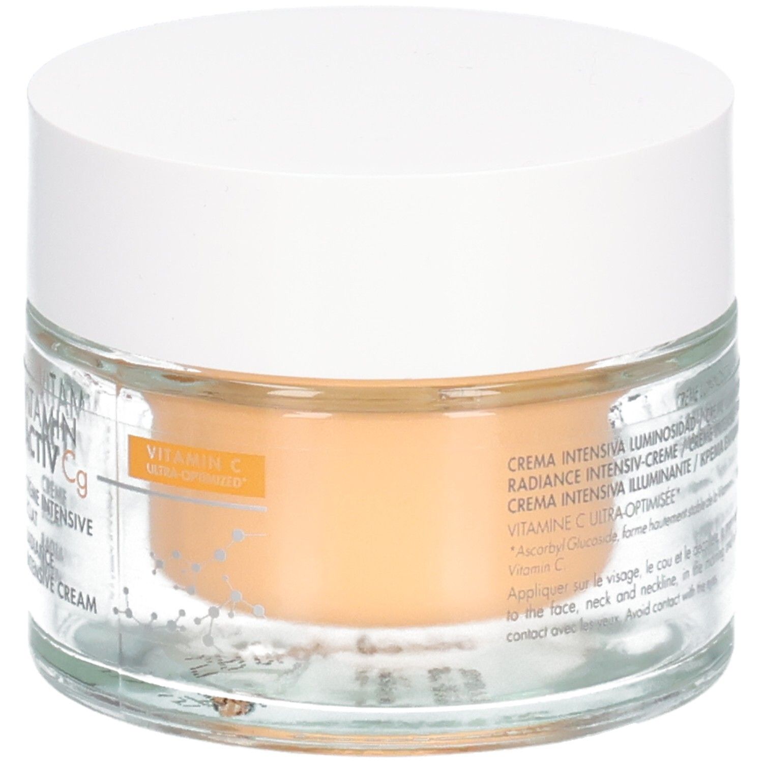 Pot en verre avec couvercle blanc. Inscription: Avene, Vitamin Activ Cg, Crème Intensive Eclat, Radiance Intensive Cream. Contenu orangé.