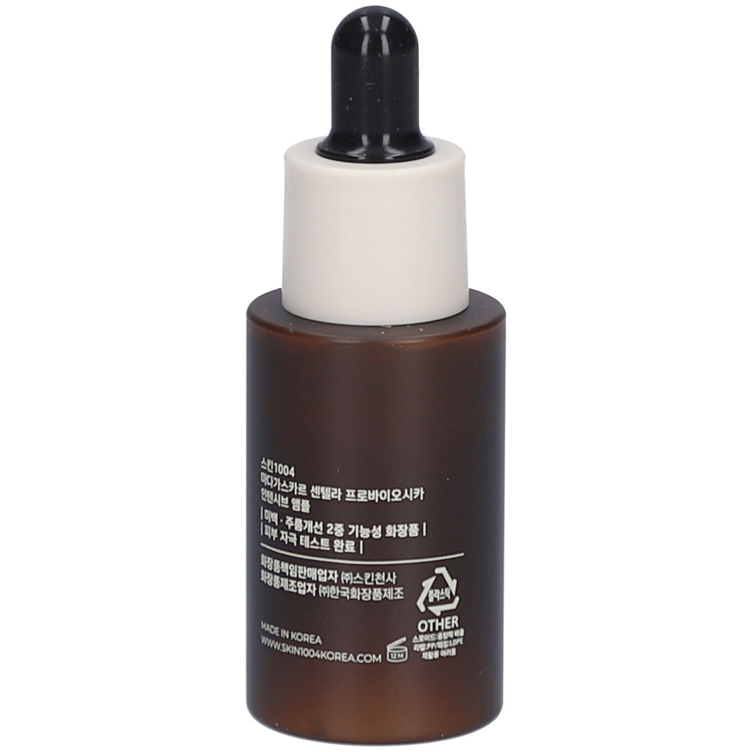 Flacon de sérum brun avec bouchon noir et embout blanc. Dos avec texte.