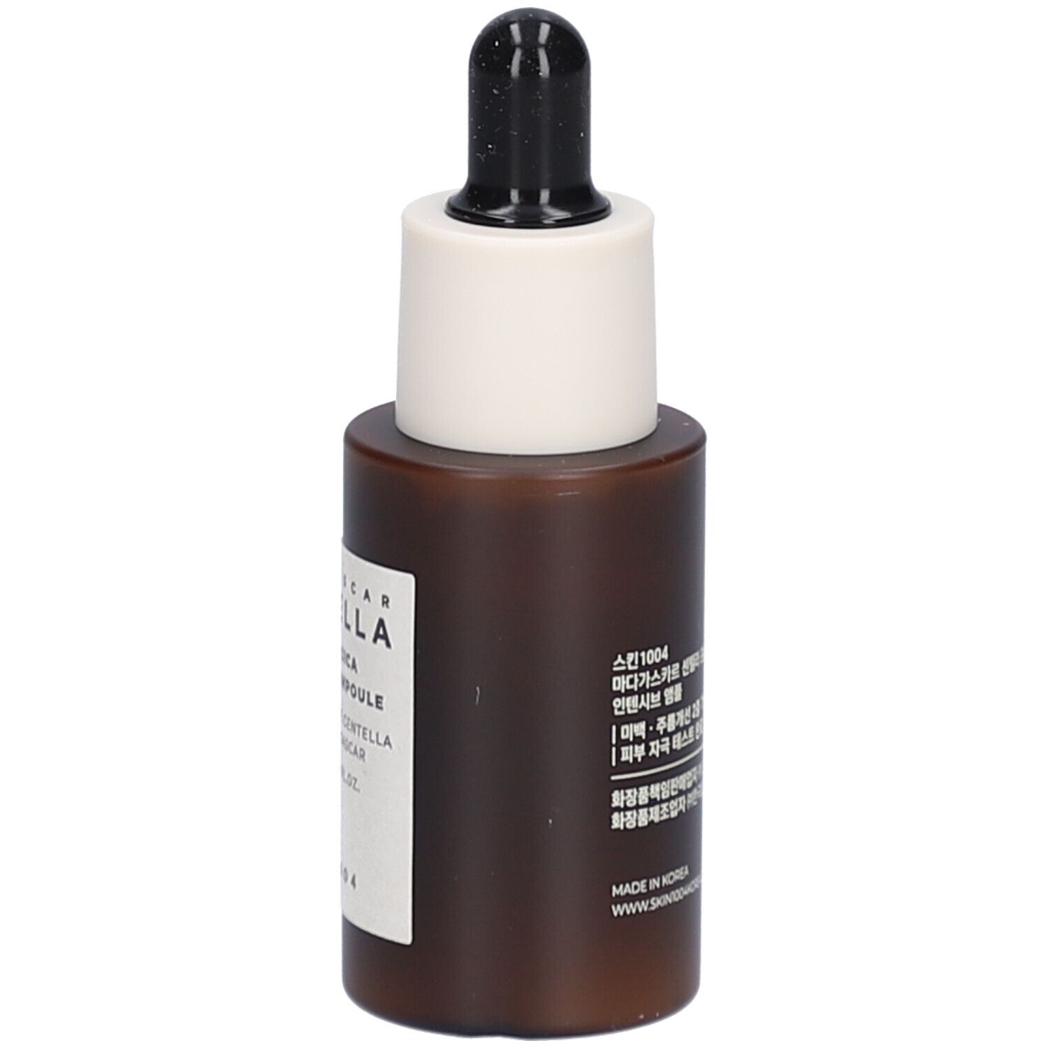 Flacon de sérum brun avec bouchon noir et embout blanc. Étiquette avec texte.